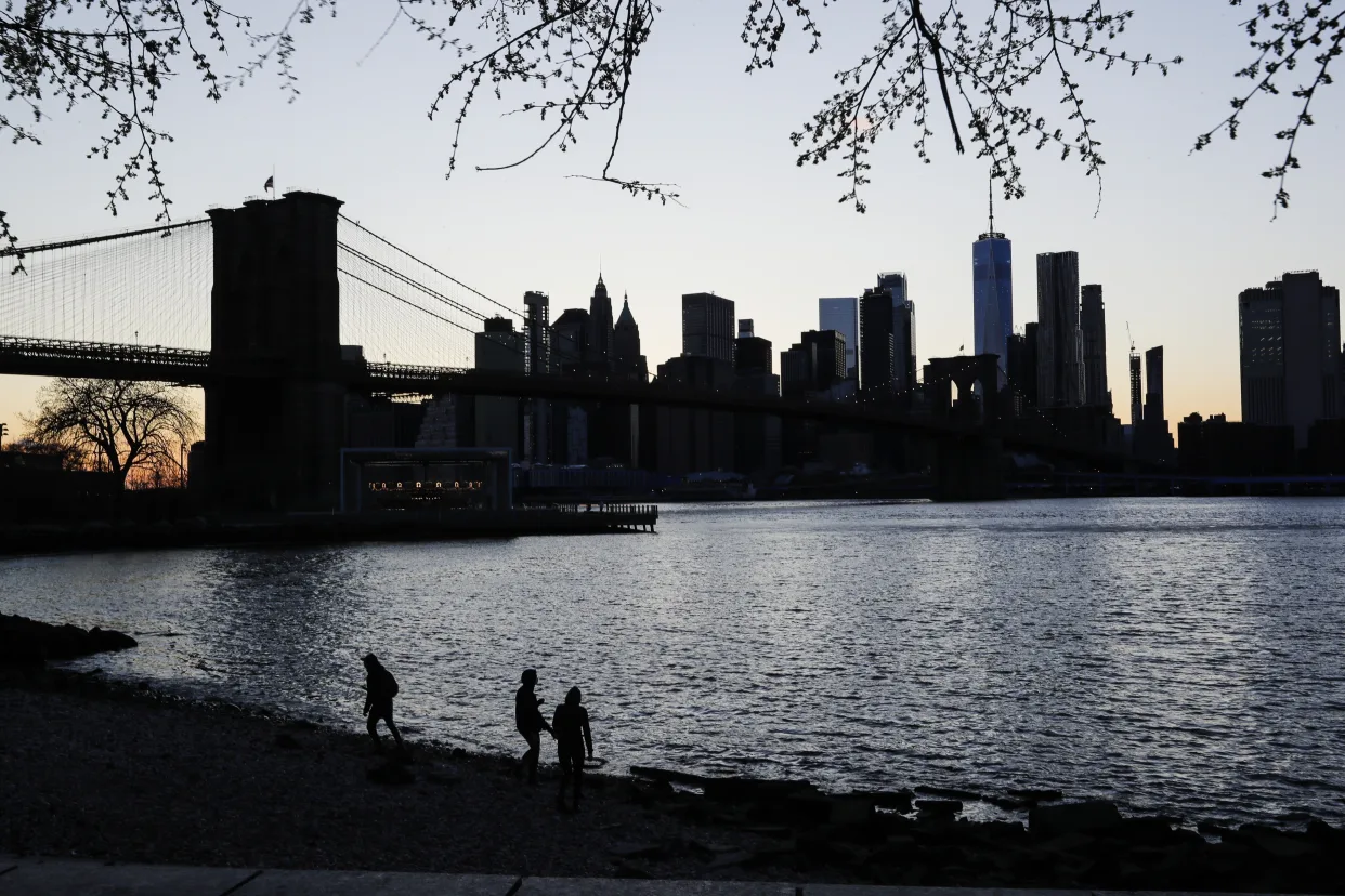 City skyline at night near water