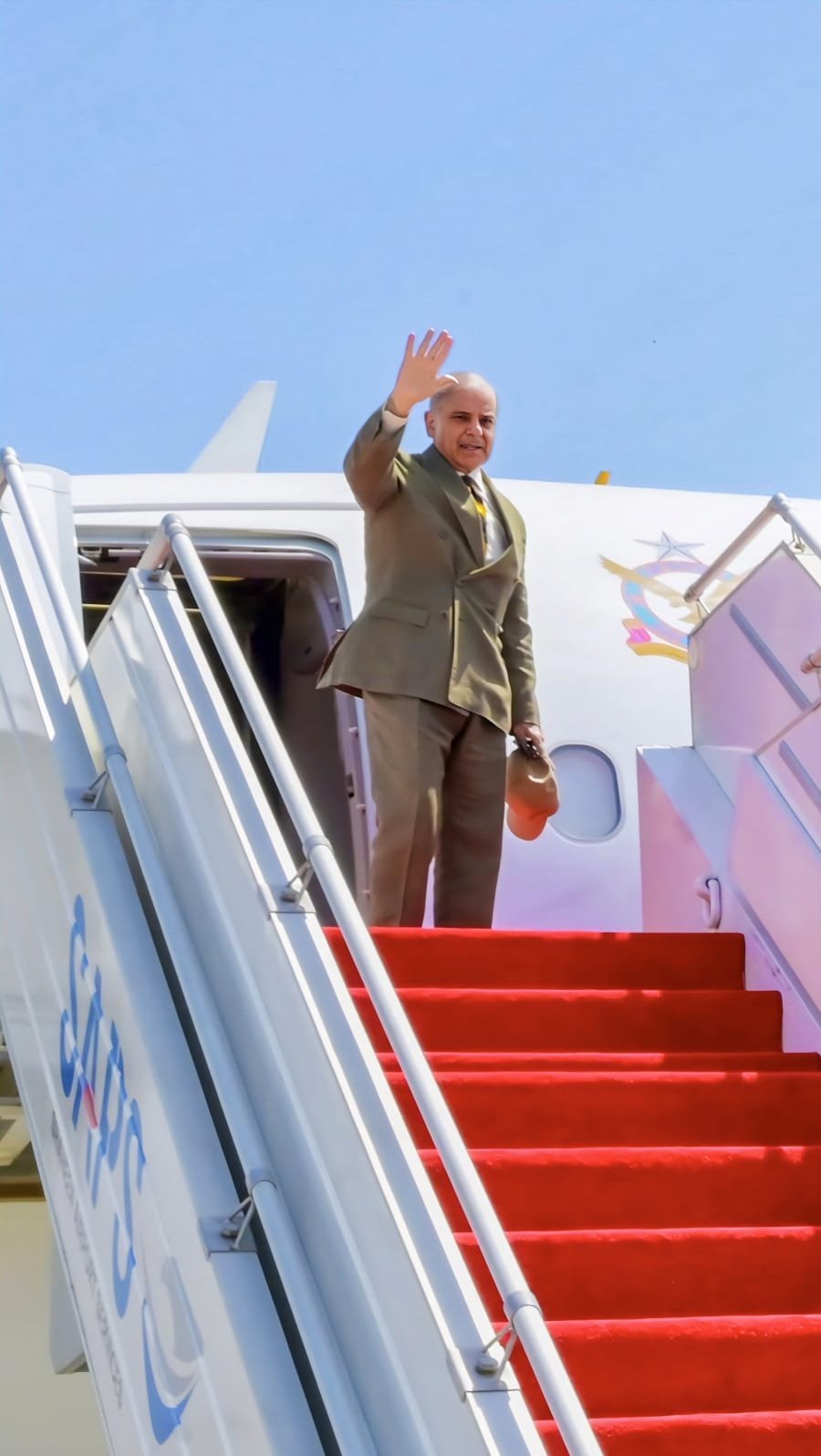 PM Shehbaz Sharif boarding aircraft for diplomatic tour.