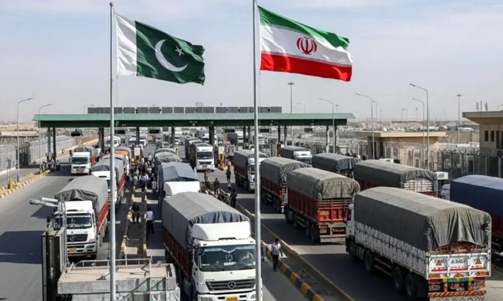 Pakistan and Uzbekistan flags with trucks