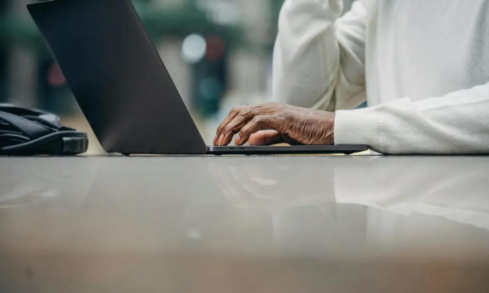 Person working on laptop, software export tax news
